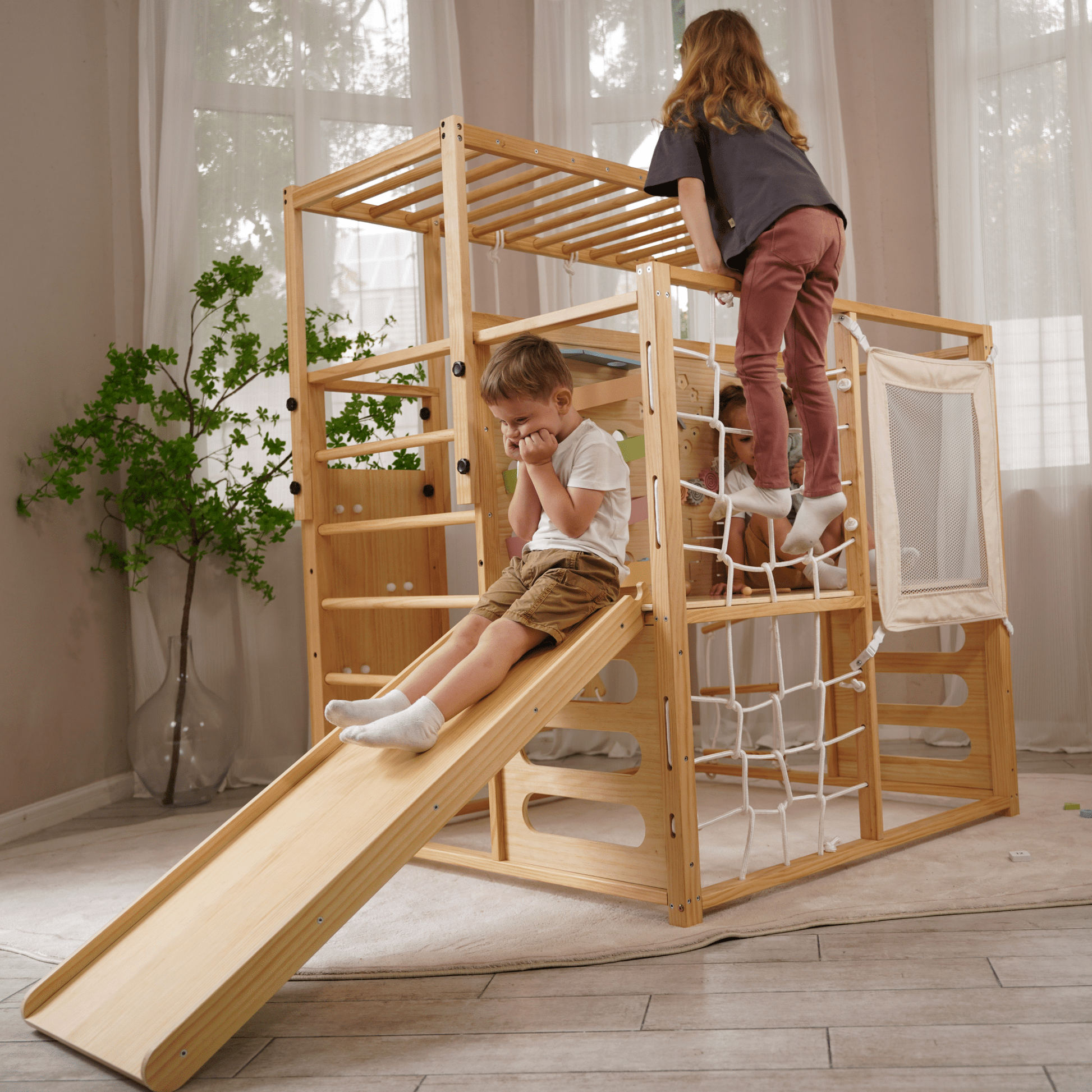 Alpine indoor climbing gym with slide and climbing wall - The Nurturing Nook