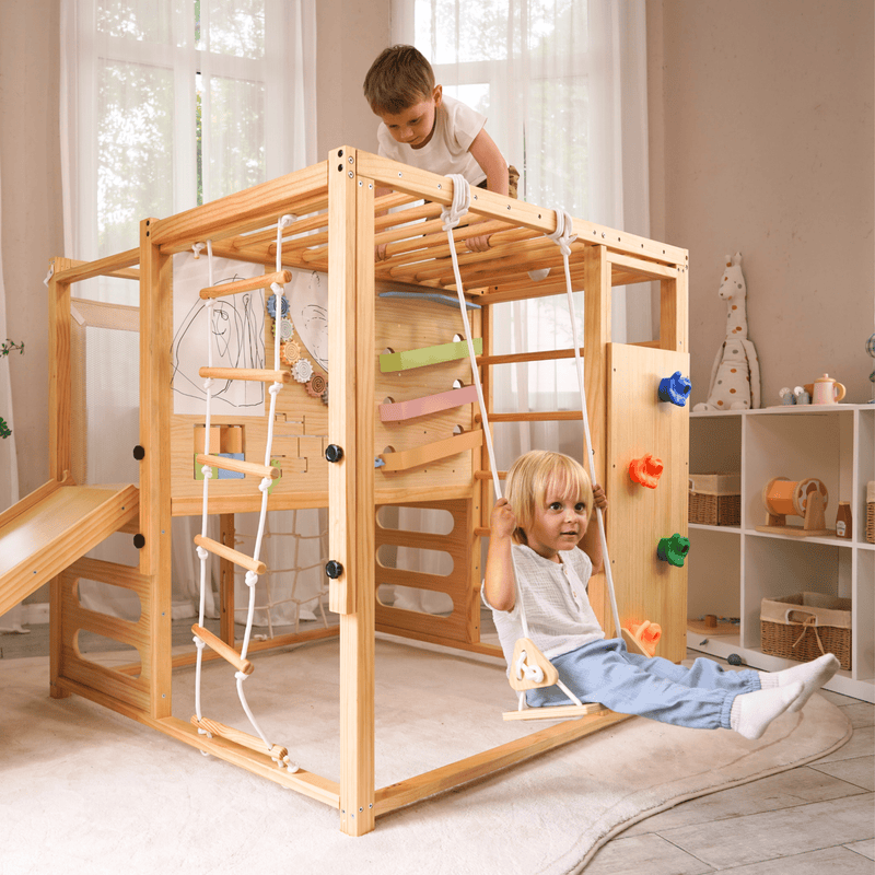 Alpine indoor climbing gym with slide and climbing wall