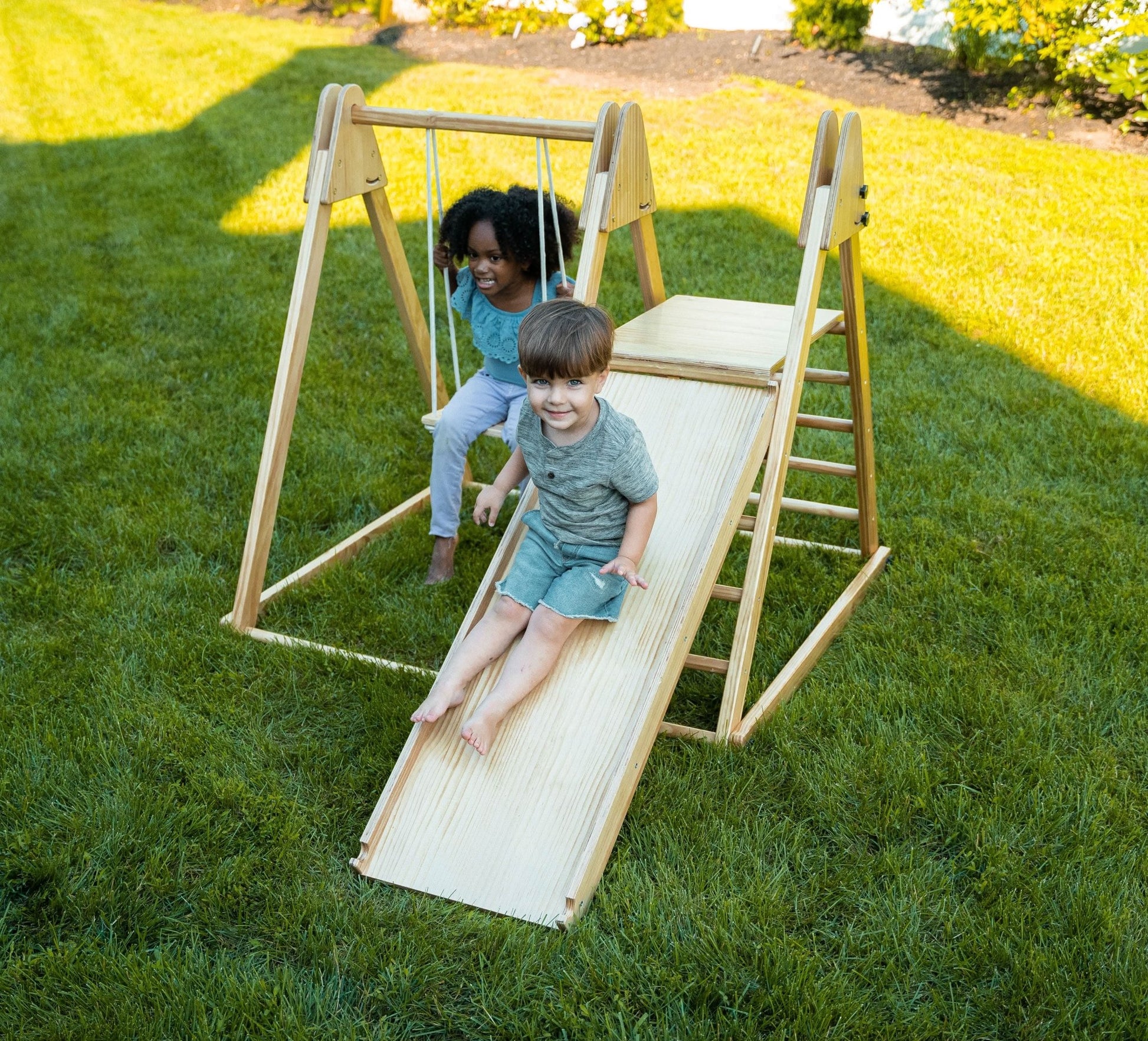 Foldable playset with slide, swings & rock wall - The Nurturing Nook