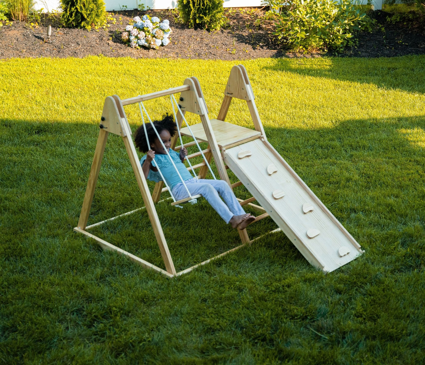 Foldable playset with slide, swings & rock wall - The Nurturing Nook