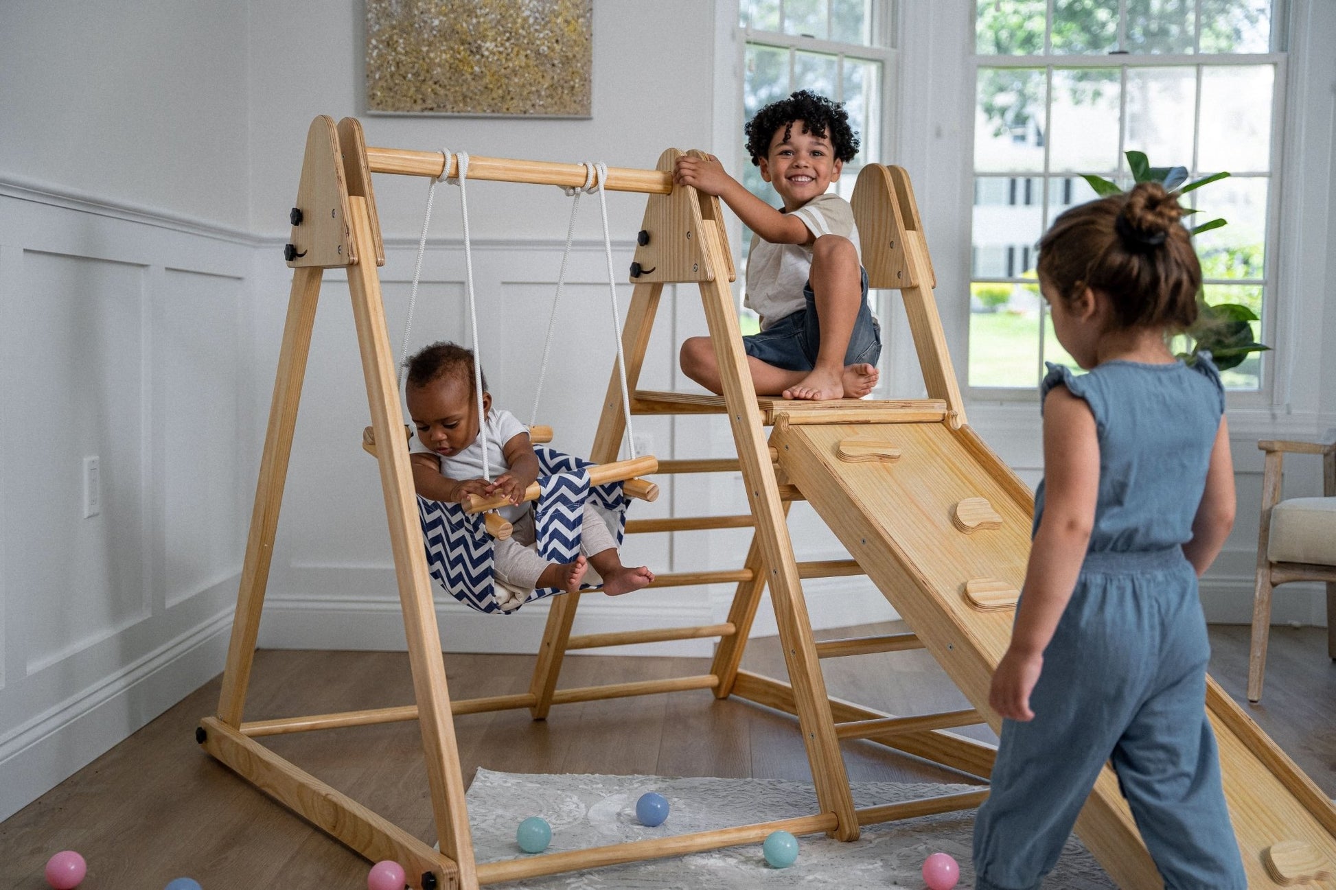 Foldable playset with slide, swings & rock wall - The Nurturing Nook