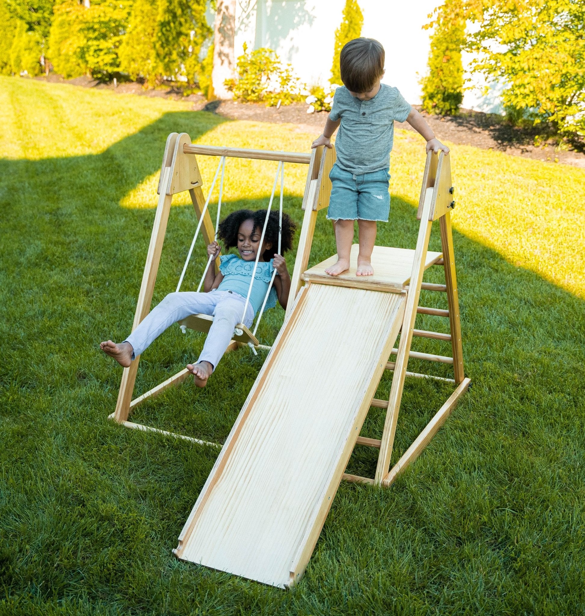 Foldable playset with slide, swings & rock wall - The Nurturing Nook