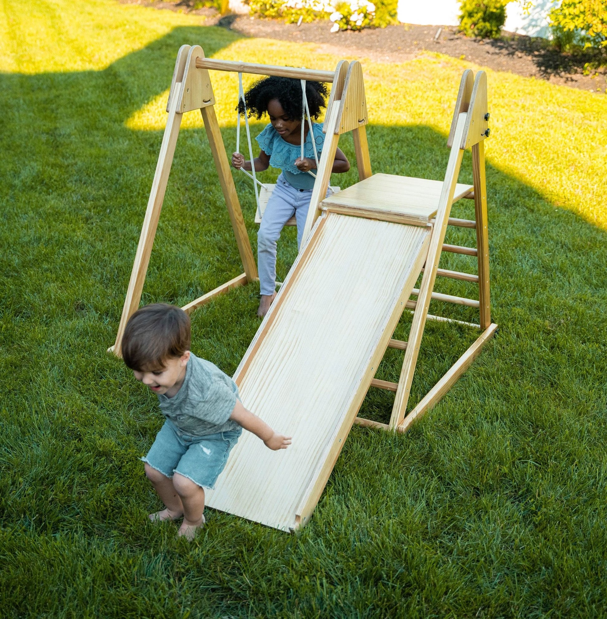 Foldable playset with slide, swings & rock wall - The Nurturing Nook