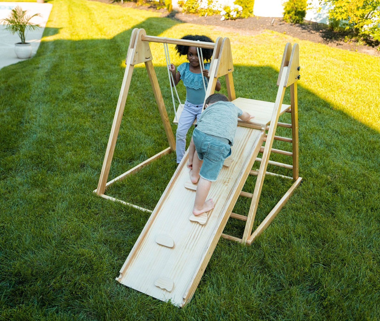Foldable playset with slide, swings & rock wall - The Nurturing Nook
