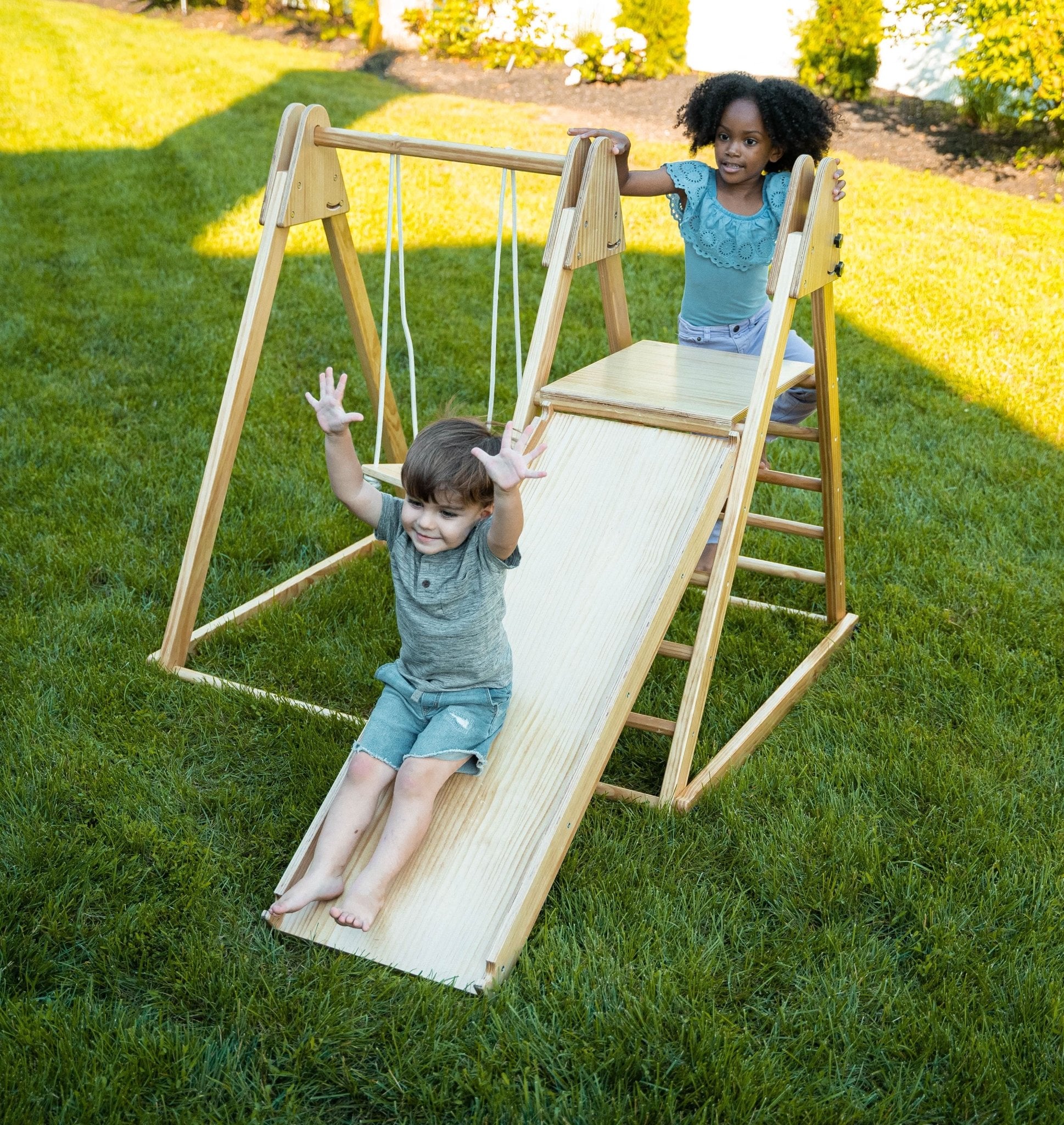 Foldable playset with slide, swings & rock wall - The Nurturing Nook