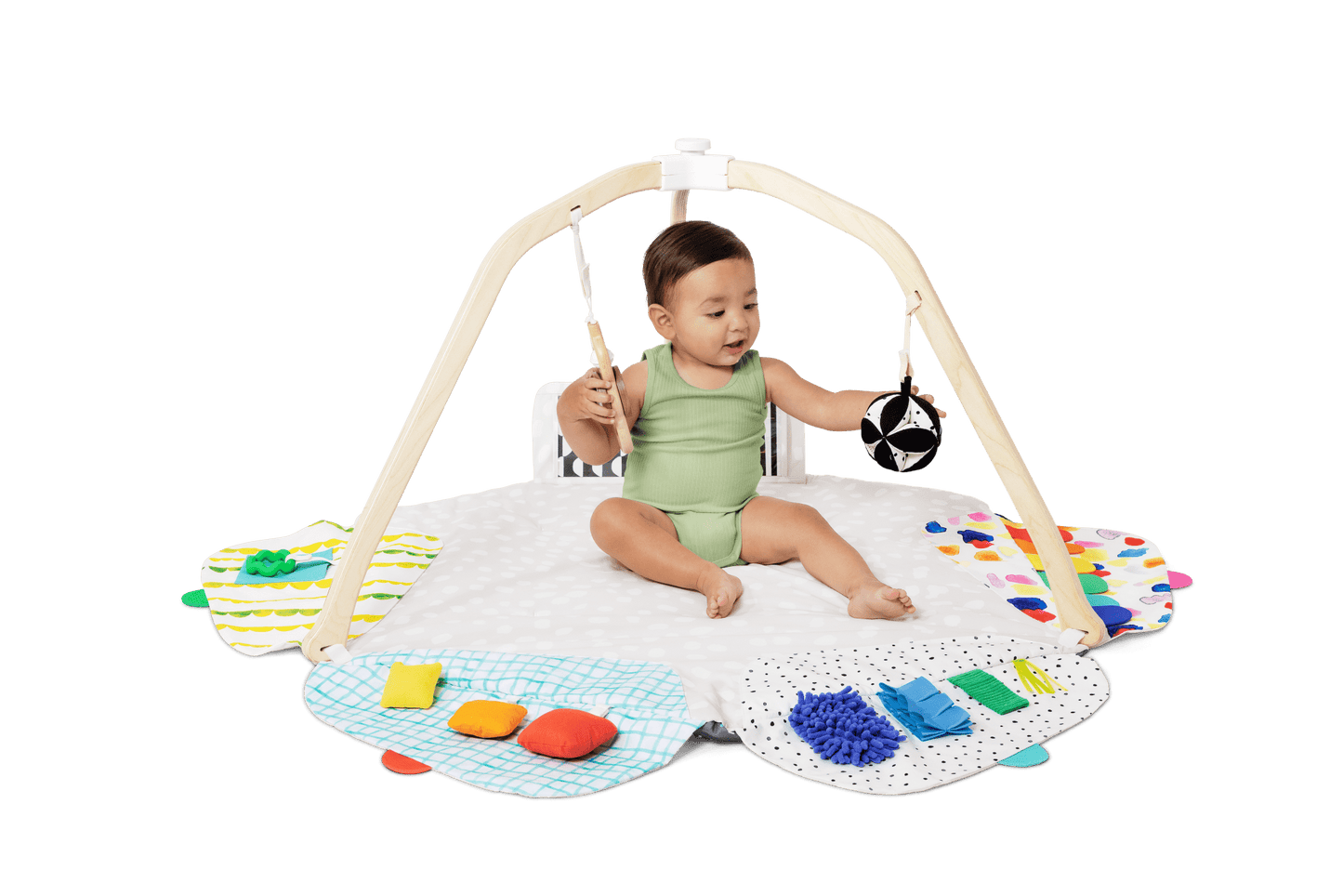 Montessori - aligned play gym for babies with sensory toys - The Nurturing Nook