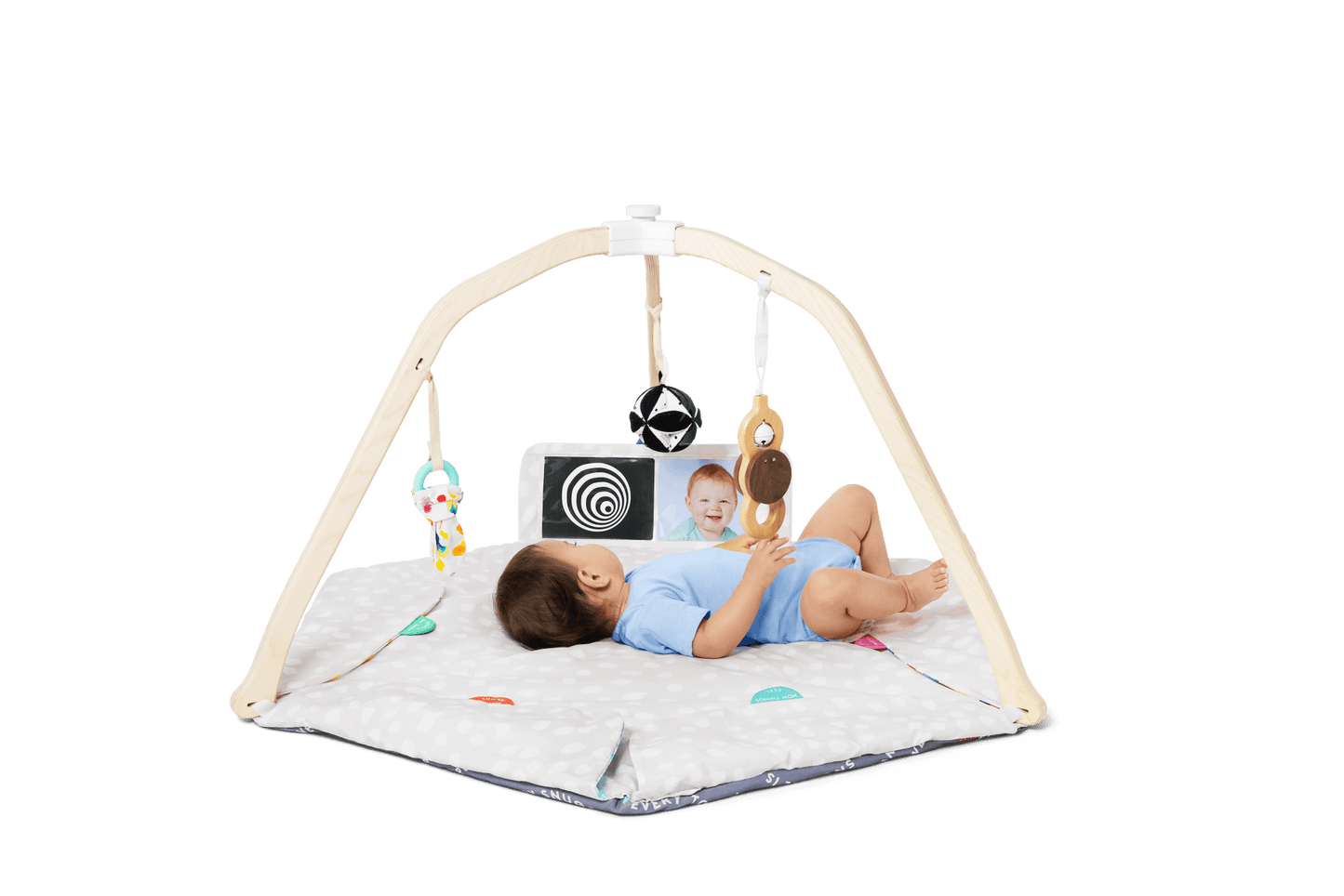 Montessori - aligned play gym for babies with sensory toys - The Nurturing Nook