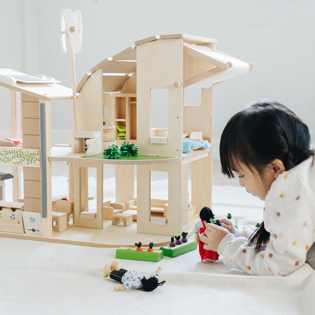 PlanToys Green dollhouse with furniture - The Nurturing Nook