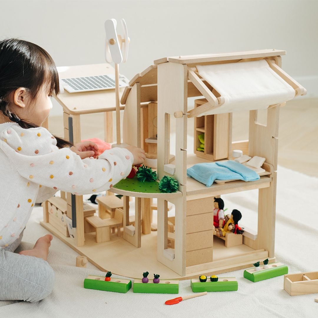 PlanToys Green dollhouse with furniture - The Nurturing Nook