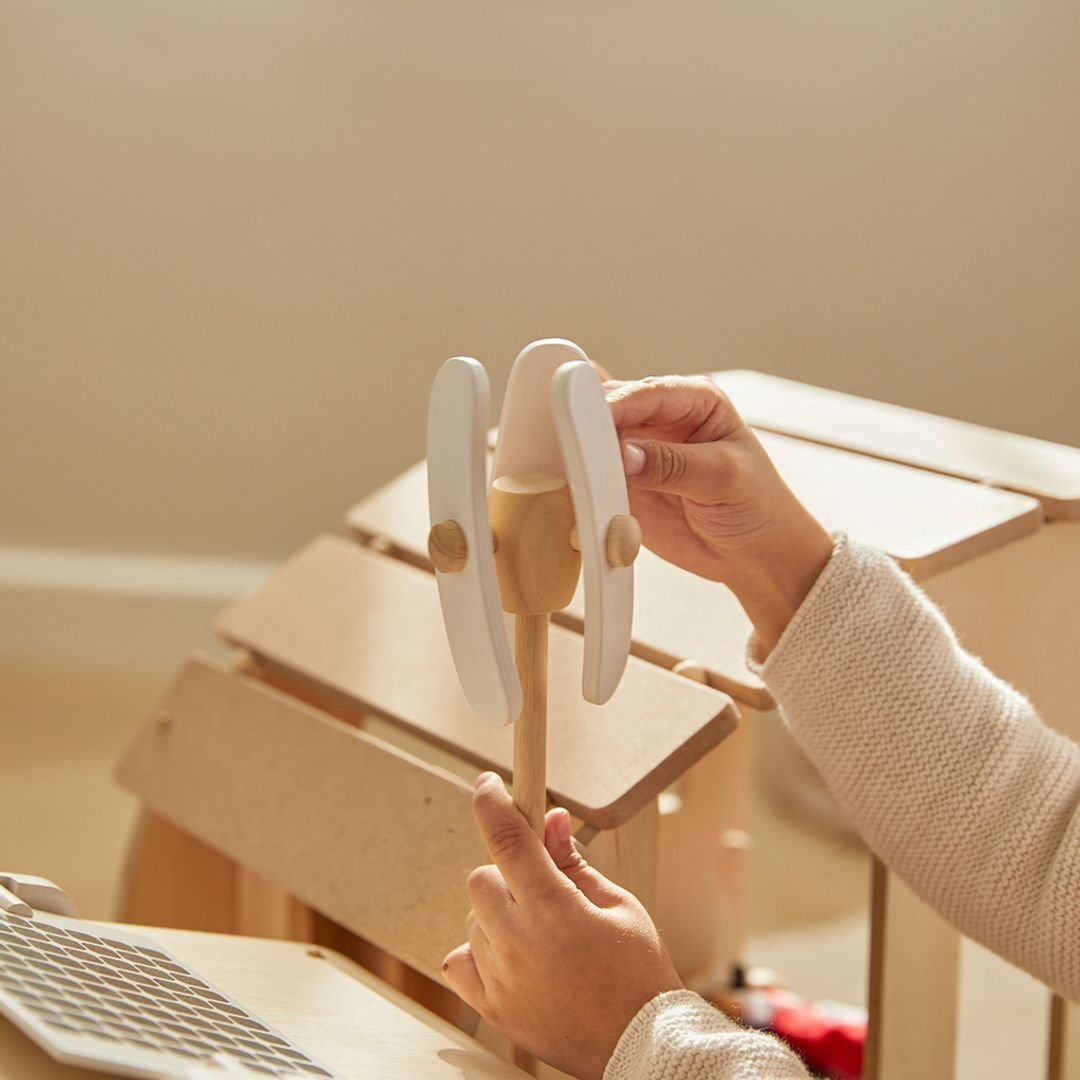 PlanToys Green dollhouse with furniture - The Nurturing Nook