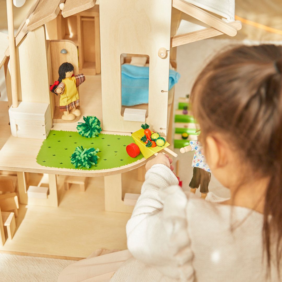PlanToys Green dollhouse with furniture - The Nurturing Nook