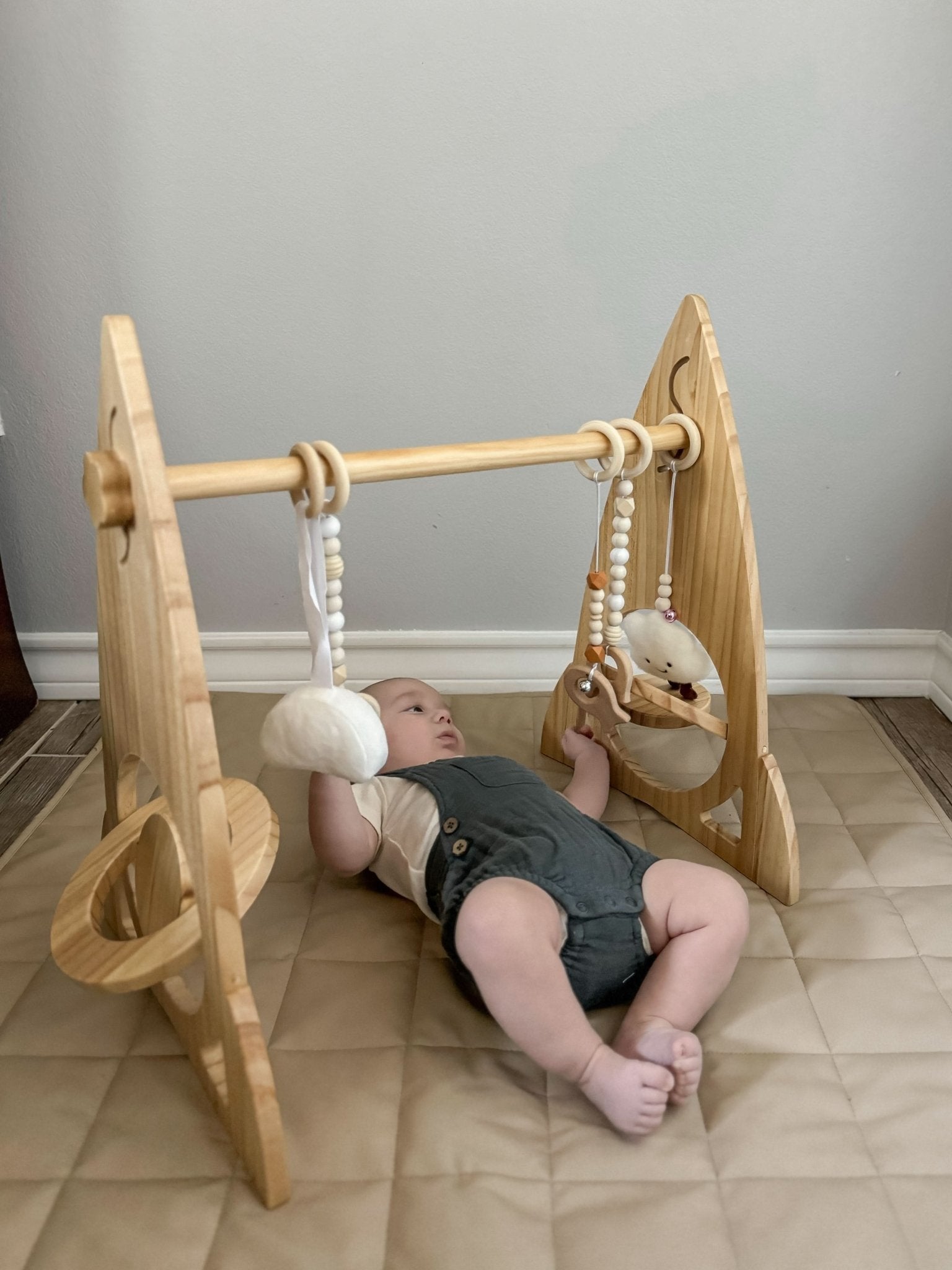 Rocket wooden baby gym for sensory and motor play - The Nurturing Nook