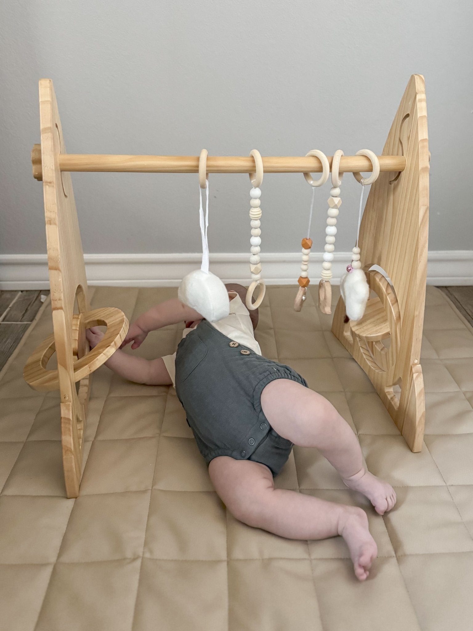 Rocket wooden baby gym for sensory and motor play - The Nurturing Nook