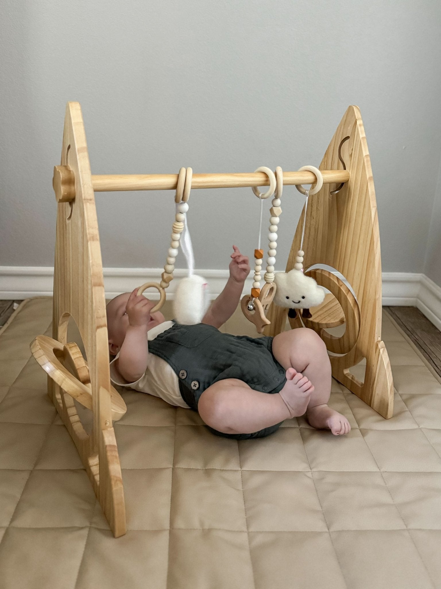 Rocket wooden baby gym for sensory and motor play - The Nurturing Nook
