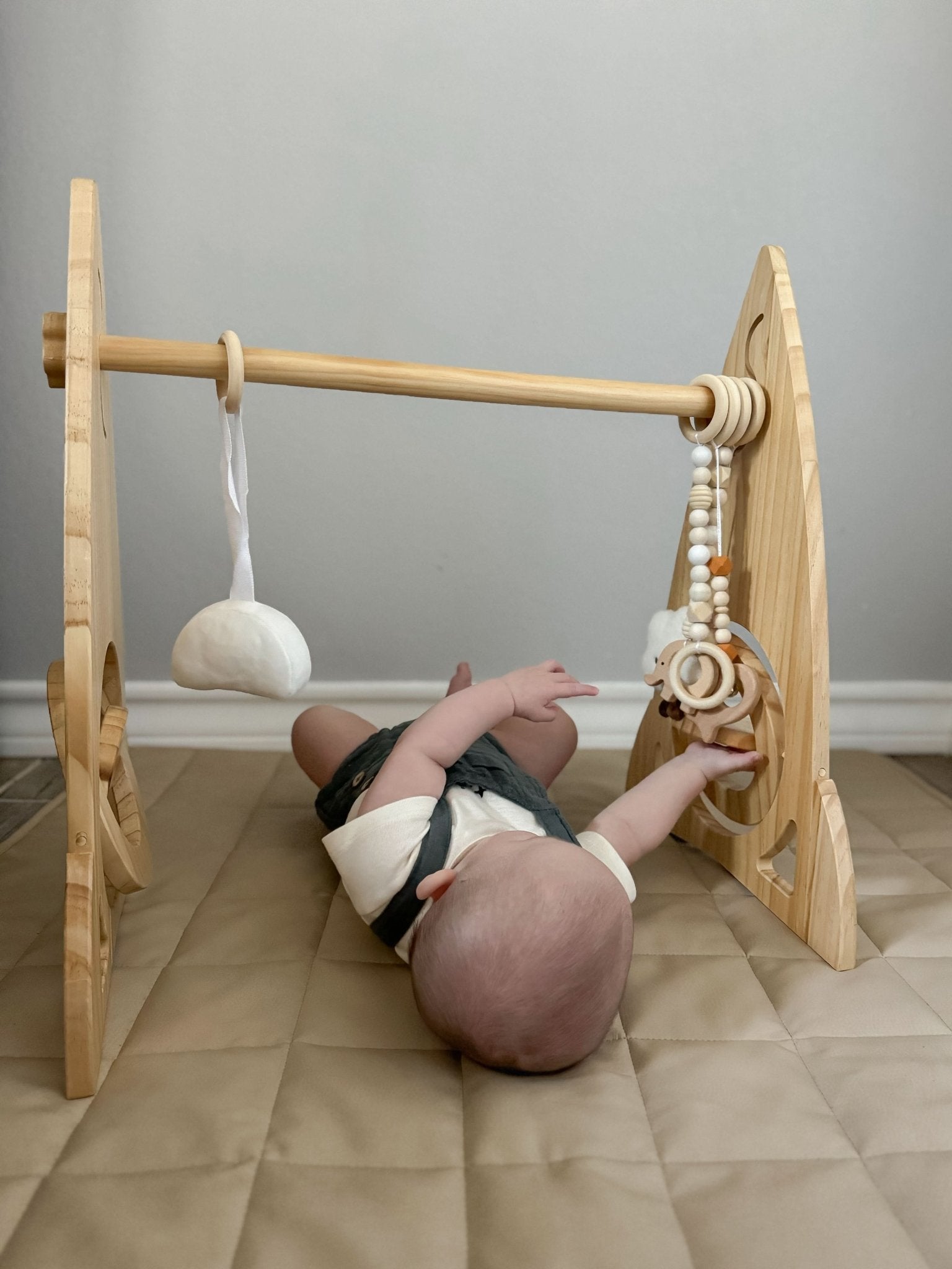 Rocket wooden baby gym for sensory and motor play - The Nurturing Nook