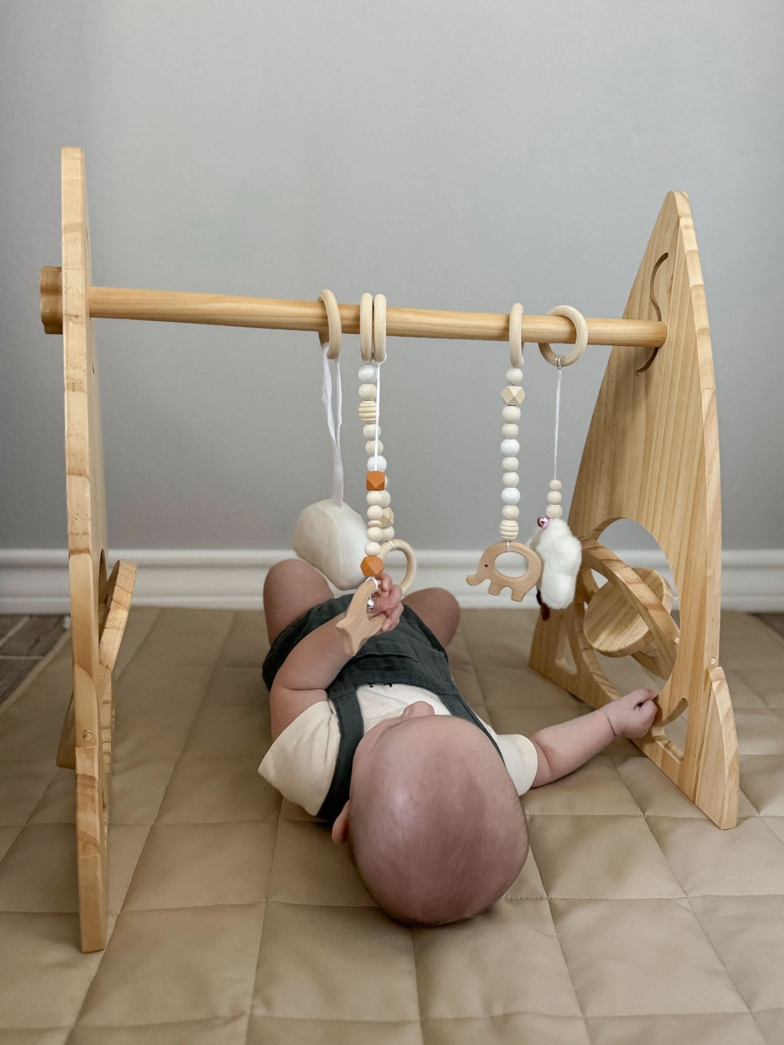 Rocket wooden baby gym for sensory and motor play - The Nurturing Nook