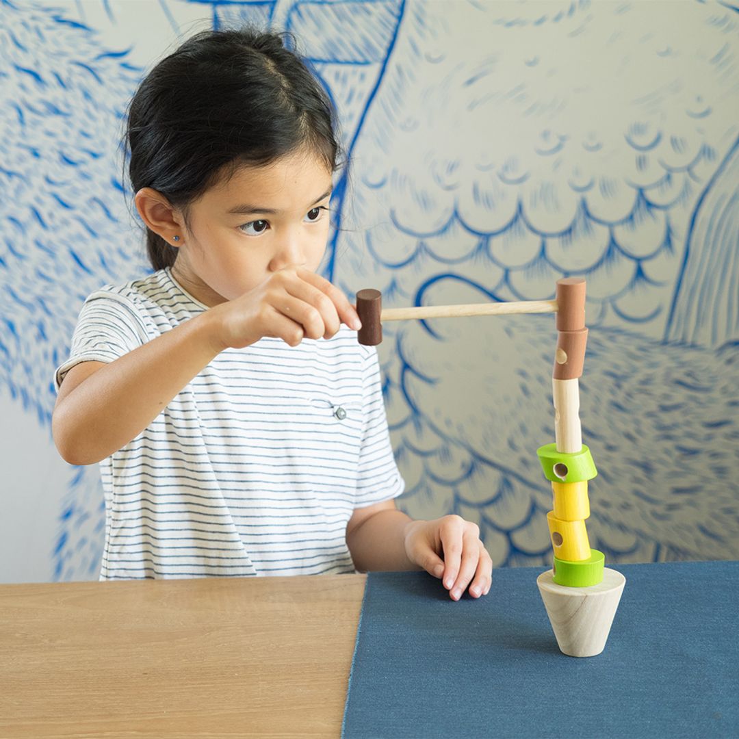 Stacking Logs - The Nurturing Nook