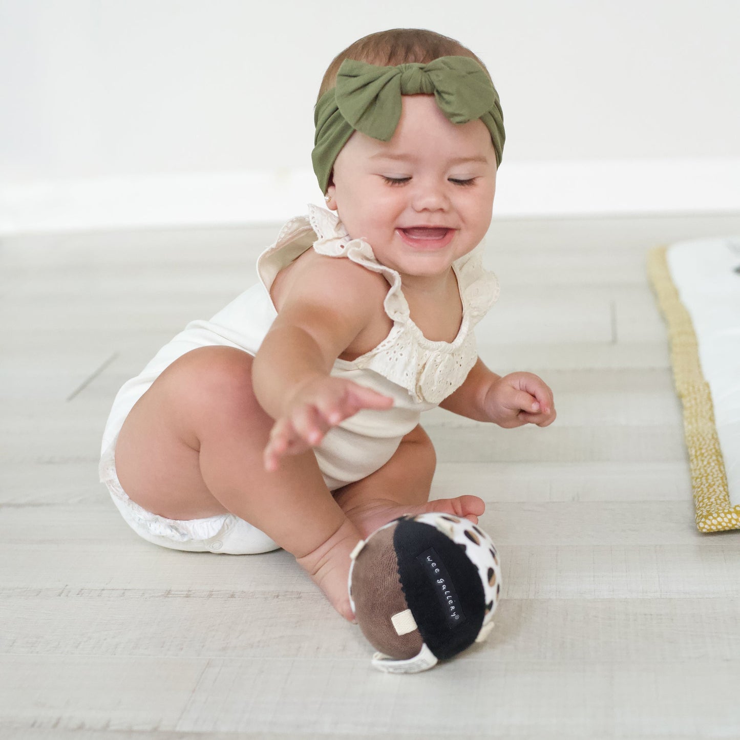 Taggy Ball with Rattle - Acorn - The Nurturing Nook