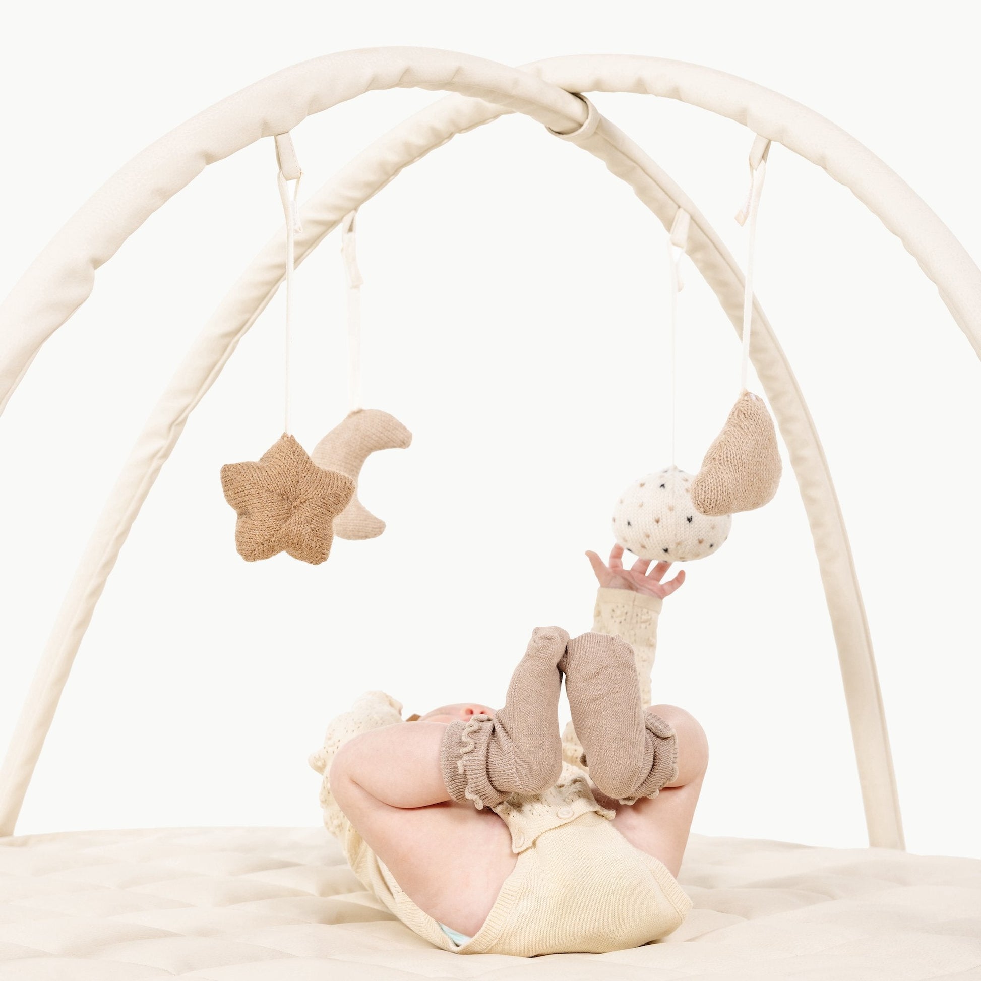 Vegan leather play gym with alpaca knit toys - The Nurturing Nook