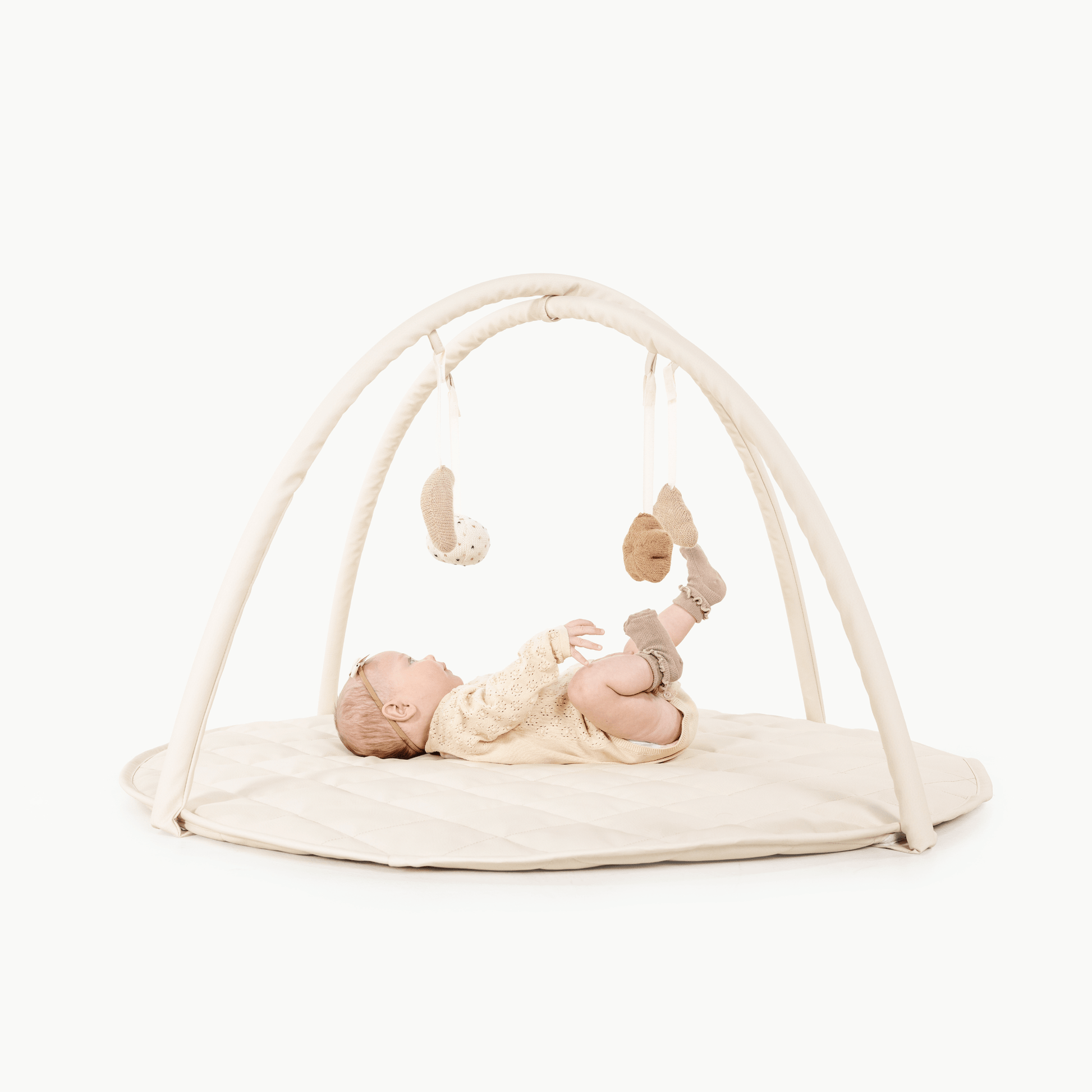 Vegan leather play gym with alpaca knit toys - The Nurturing Nook