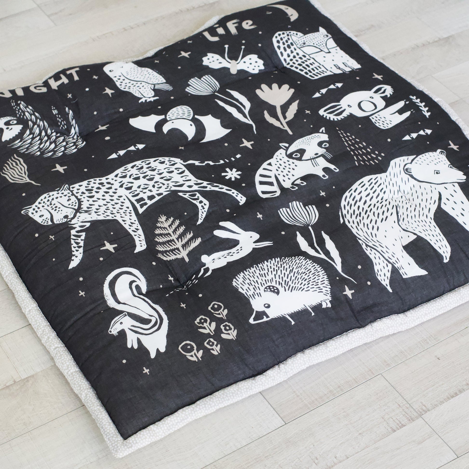 Wildlife reversible organic cotton playmat – forest, sea + plains - The Nurturing Nook