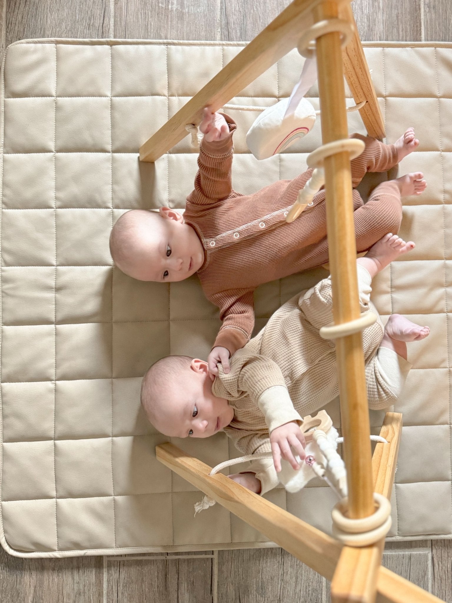 Wooden baby gym for sensory and motor play - The Nurturing Nook