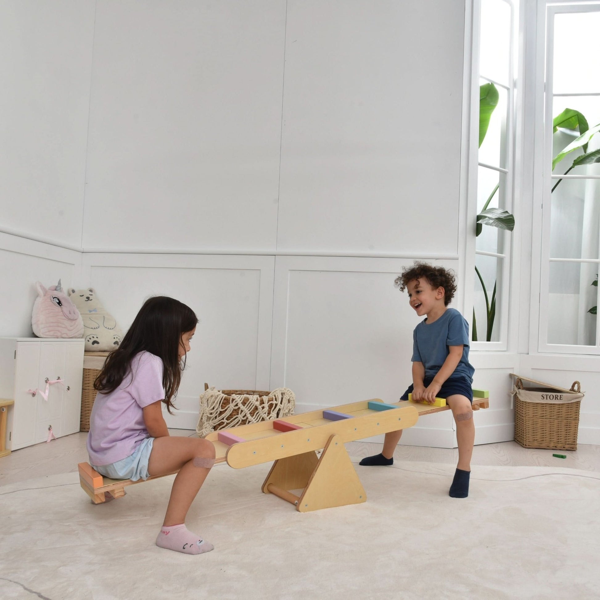 Wooden rainbow seesaw and balance beam - The Nurturing Nook