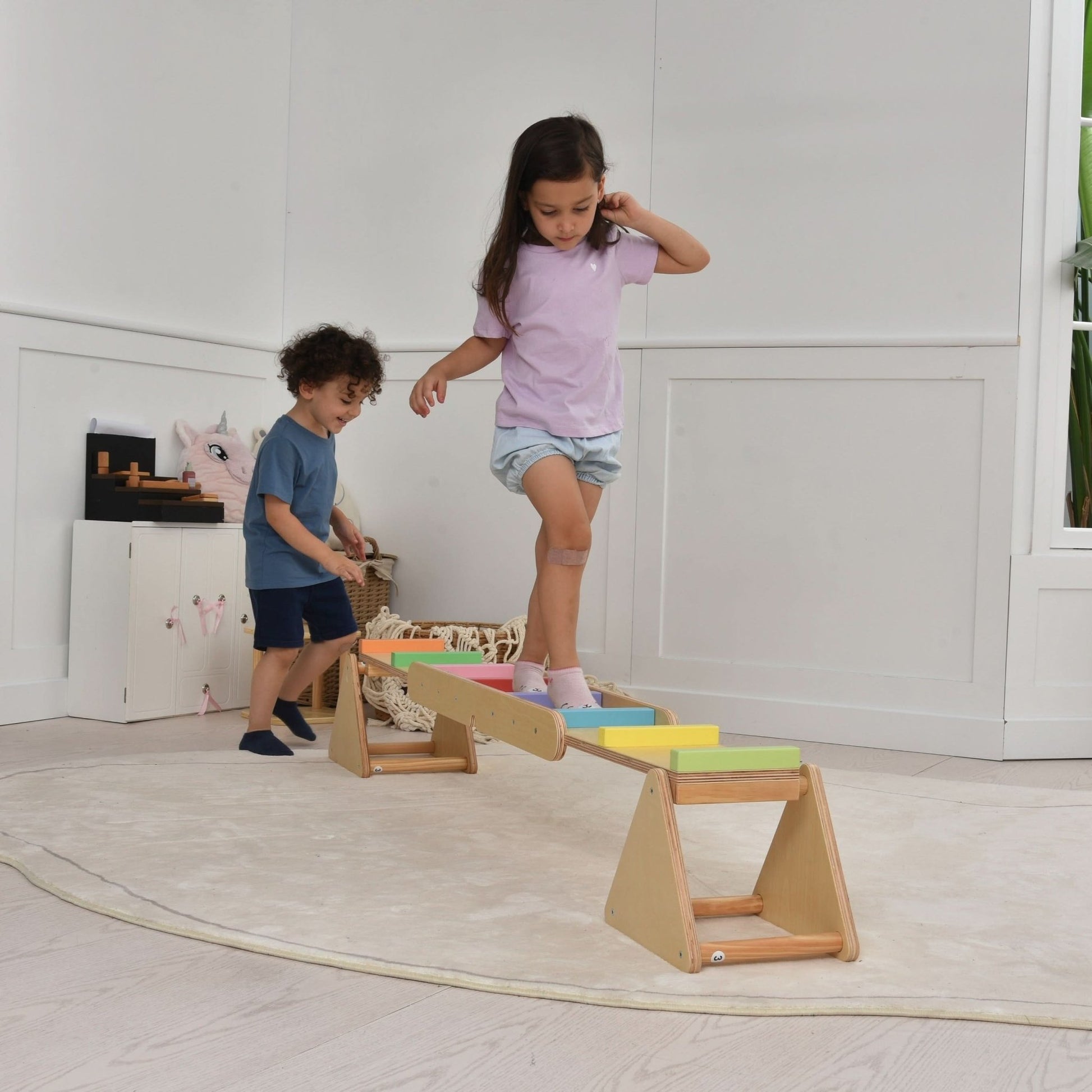 Wooden rainbow seesaw and balance beam - The Nurturing Nook