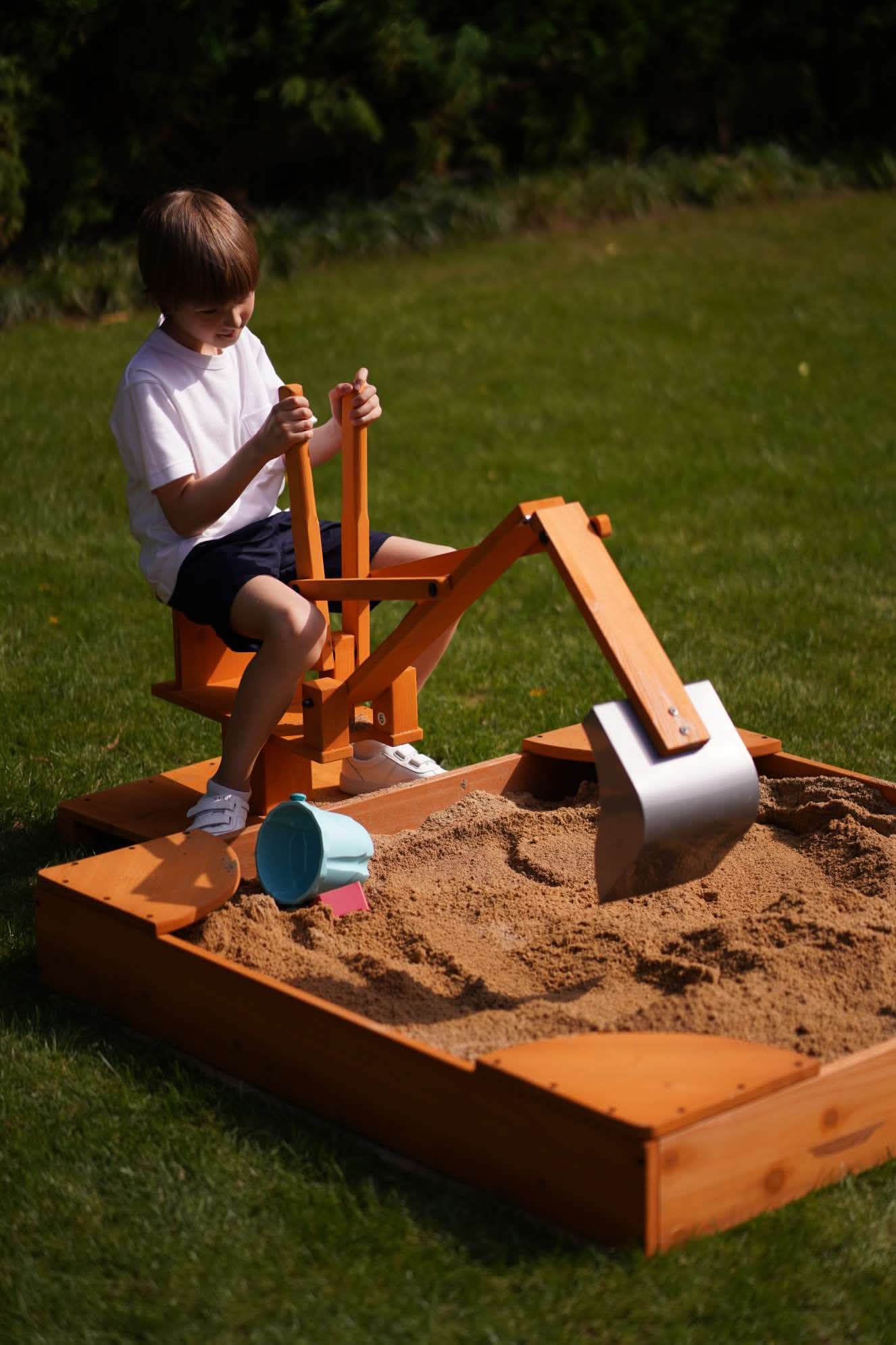 Wooden ride - on outdoor excavator for toddlers - The Nurturing Nook