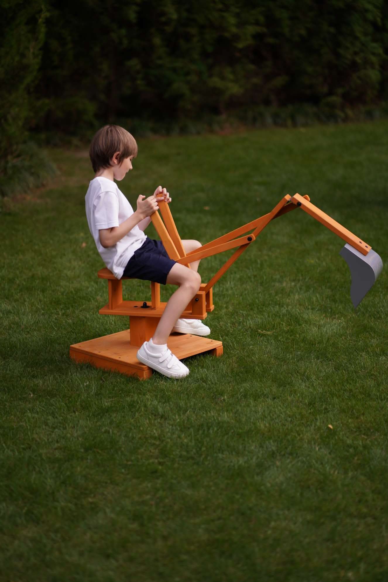 Wooden ride - on outdoor excavator for toddlers - The Nurturing Nook