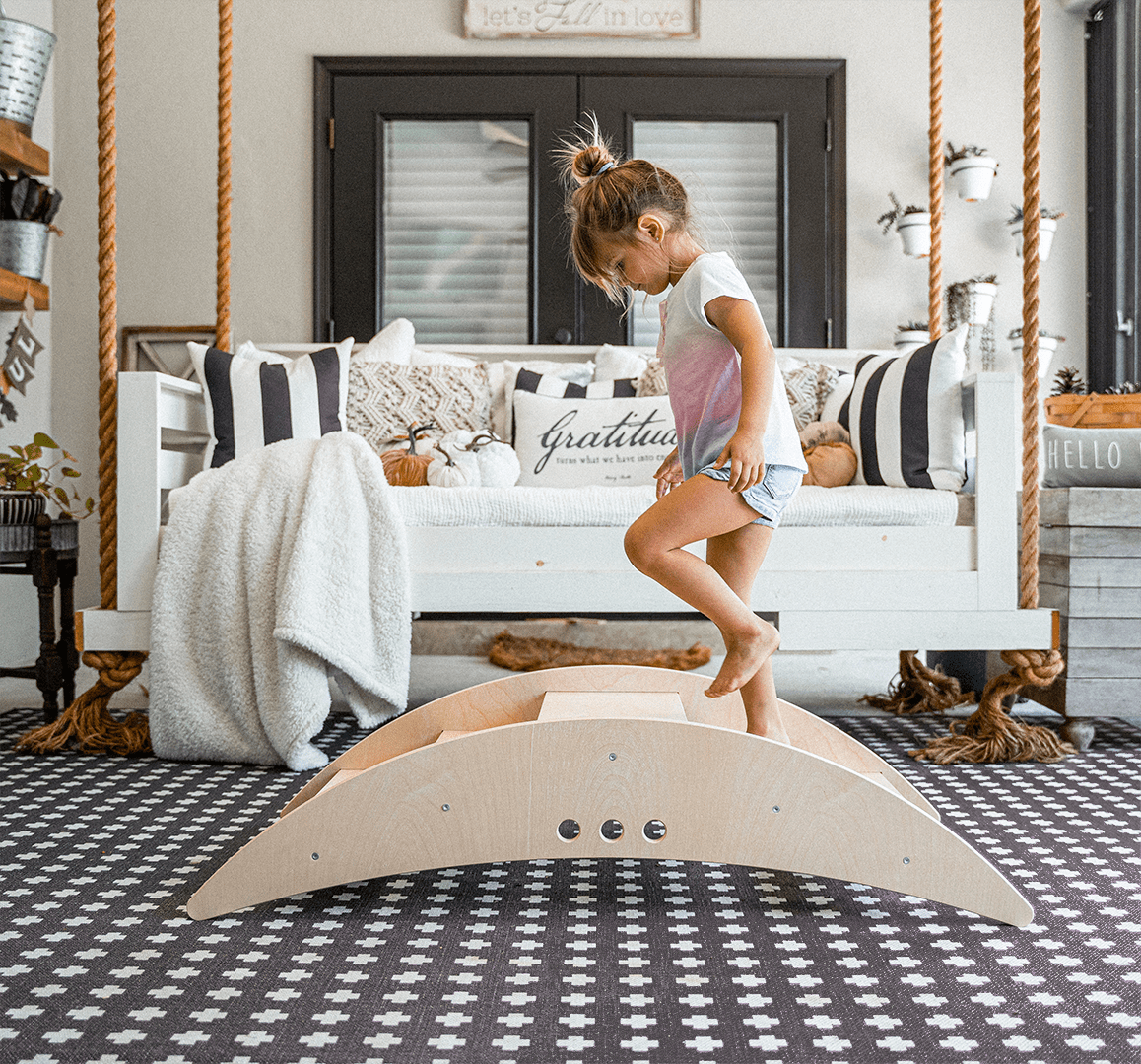 Wooden rocking boat and climber – gross motor play - The Nurturing Nook