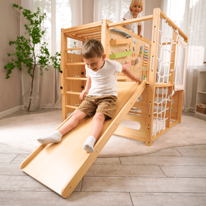 Alpine indoor climbing gym with slide and climbing wall - The Nurturing Nook