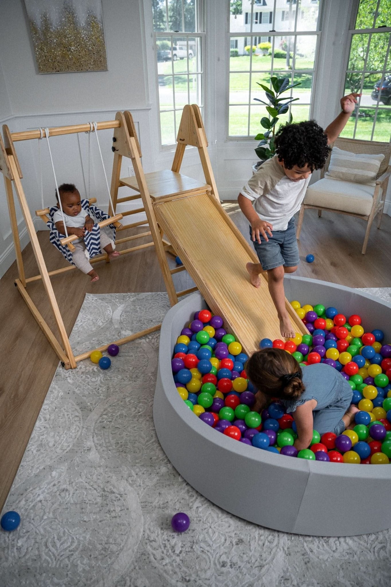 Foldable playset with slide, swings & rock wall - The Nurturing Nook
