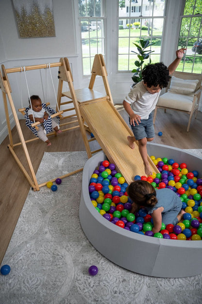Foldable playset with slide, swings & rock wall - The Nurturing Nook