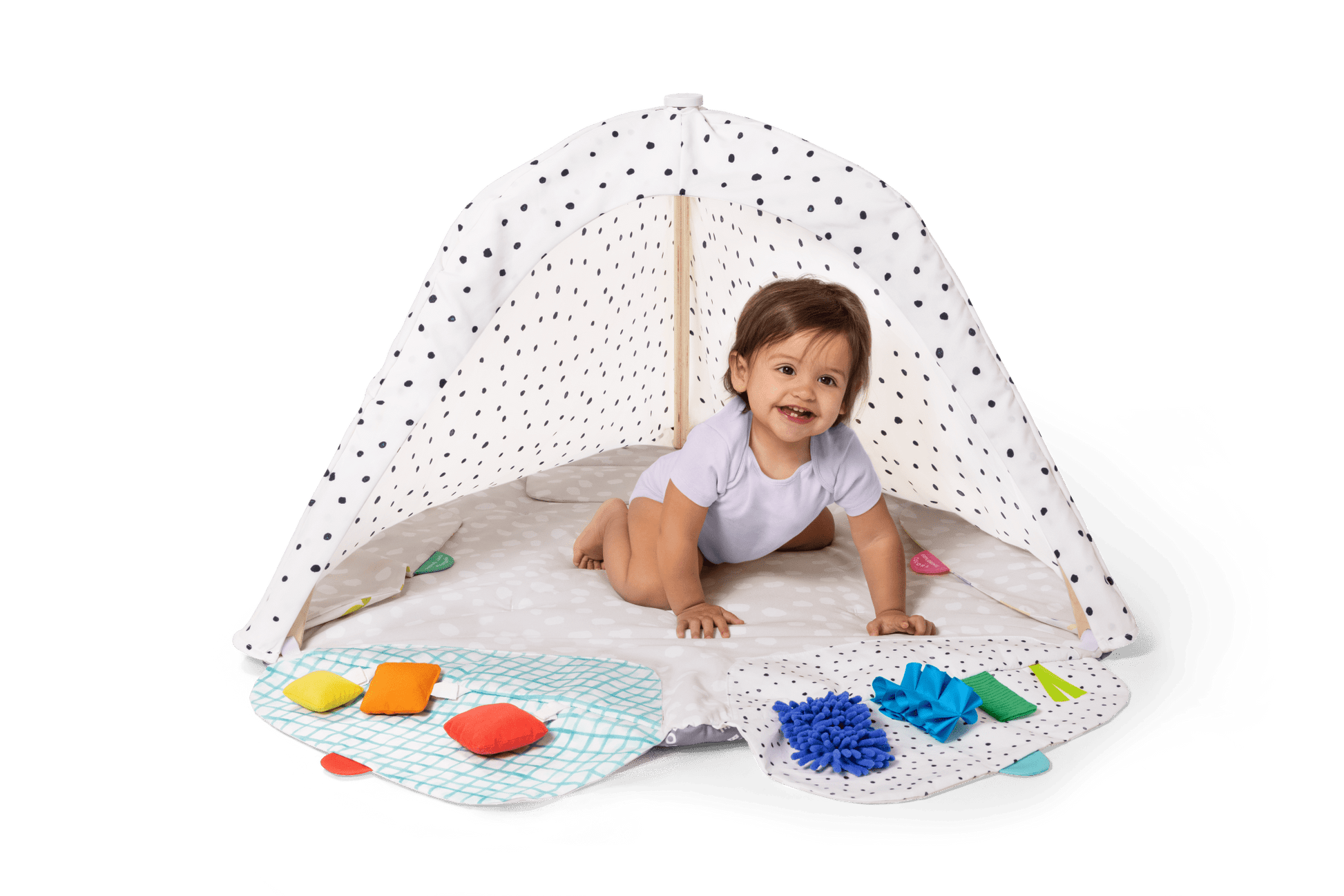 Montessori - aligned play gym for babies with sensory toys - The Nurturing Nook