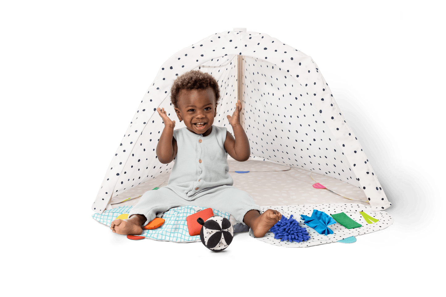 Montessori - aligned play gym for babies with sensory toys - The Nurturing Nook