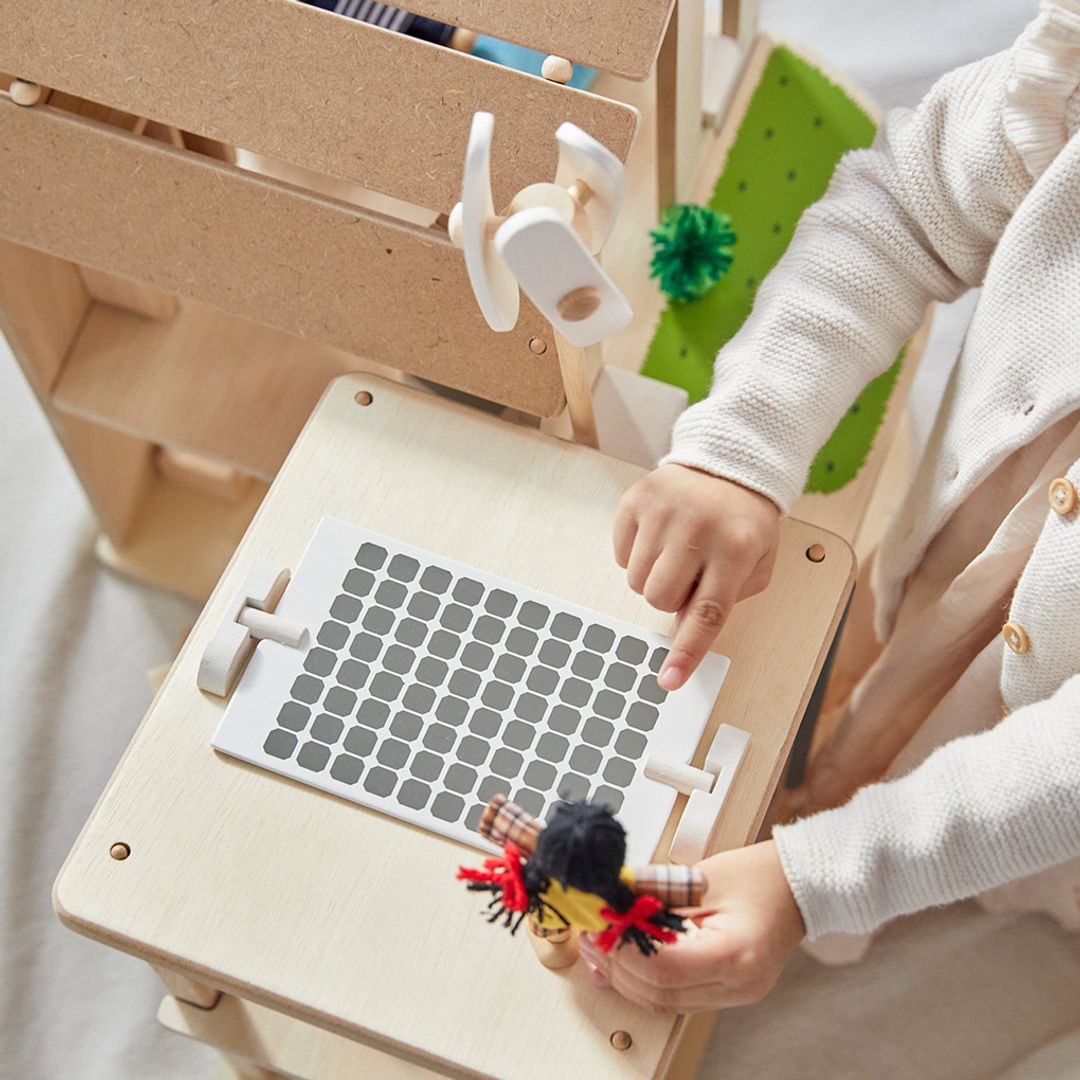 PlanToys Green dollhouse with furniture - The Nurturing Nook