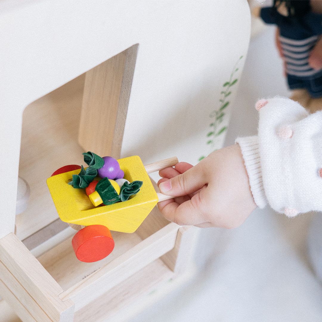 PlanToys Green dollhouse with furniture - The Nurturing Nook