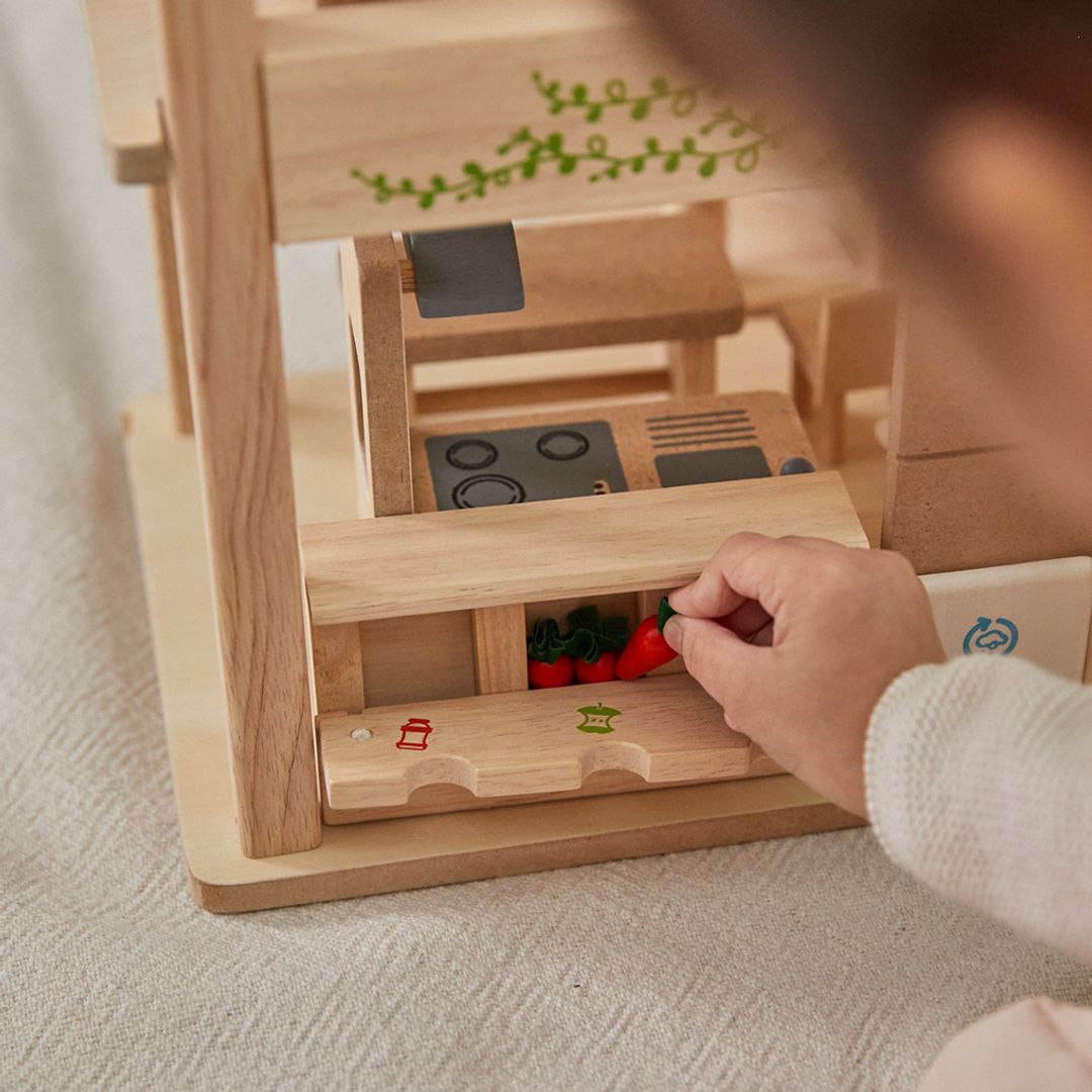 PlanToys Green dollhouse with furniture - The Nurturing Nook