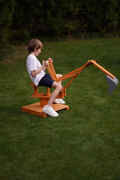 Wooden ride - on outdoor excavator for toddlers - The Nurturing Nook